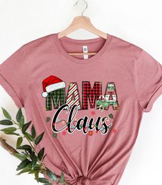 Mama Claus Christmas Mom Shirt, Christmas Mommy Gift, Mama Claus Shirt, Family Christmas Shirt, Holiday Mom Shirt Family Christmas Mom Tees WELCOME TO "BesTeeShirts" ! High quality and super soft, comfortable shirt. Made with top of the line vinyl and pressed with a professional grade heat press. All our simple color ones like White, Black, and Red are 100% Cotton. All our Heathered Colors are cotton/polyester blend and they are super comfy soft!   SIZING AND COLORS Make sure you check our size-chart before you place your order. If you are not sure about sizing please measure your favorite t-shirt and compare measurements to the chart for the best fit for you. For detailed sizing information and t-shirt color options, please see listing images.   HOW TO ORDER   𝟏. Please, Check and Review Mama T Shirts, Mommy Gift, Mama T Shirt, Mama Shirts, Family Christmas Shirts, Christmas Mom, Mom Tees, Simple Colors, Mama Shirt