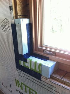 a box sitting on top of a window sill in the middle of a room