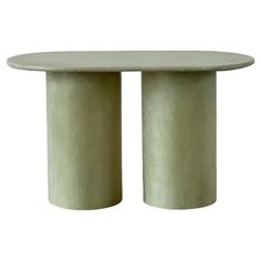 an oval table with two columns on the top and one column in the middle, against a white background