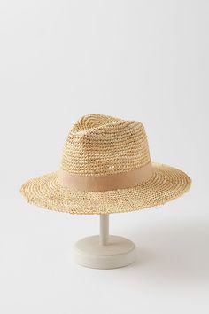 For a fresh summer look, head out with the Charlie safari hat as your finishing touch. Whether you're wearing a sundress or a linen shirt, you'll be ready for sun, sand, and socializing in this dapper design. Crafted from crocheted raffia, this lightweight hat features a grosgrain hatband with bow and an adjustable sweatband for all-day comfort. Summer Travel Sun Hat Made Of Toquilla Straw, Beachy Woven Sun Hat For Summer, Summer Beige Straw Hat For Vacation, Casual Brimmed Linen Sun Hat, Summer Brimmed Panama Hat For Vacation, Woven Summer Sun Straw Hat, Summer Woven Sun Hat For Day Out, Summer Style Brimmed Panama Hat For Vacation, Beachy Woven Straw Hat For Spring