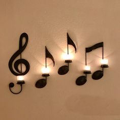 musical notes are hung on the wall with lights