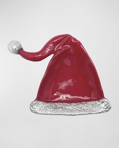 a shiny red santa hat with silver trim