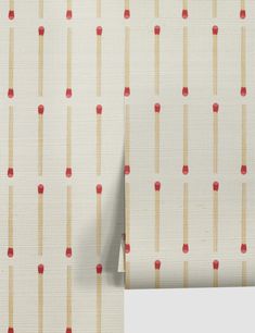 an upholstered wallpaper with red and beige pins on white fabric, closeup