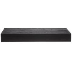 a black shelf sitting on top of a white wall