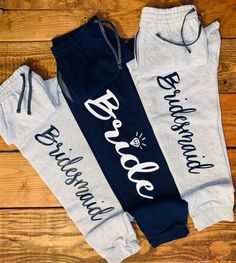 two personalized sweatpants with the words, bride and groom printed on them in white and blue