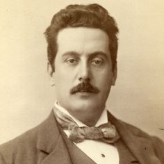 an old black and white photo of a man with a mustache