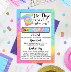 tie - dye care instructions for kids on a table with confetti and party supplies