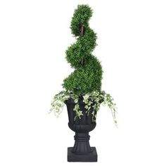 a potted plant in the shape of a number three on top of a pedestal