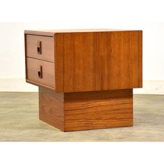 a wooden cabinet with two drawers on the bottom and one drawer open to reveal something