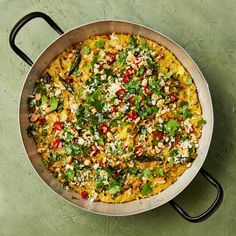 a pan filled with food sitting on top of a table