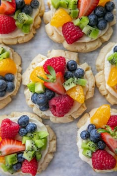 small cookies decorated with fresh fruit and kiwis