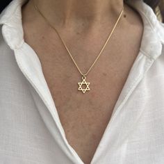 "The Gold Star of David Necklace is a stunning piece of jewelry that symbolizes Jewish heritage and faith. Crafted in radiant gold, this necklace features the iconic Star of David charm, representing unity, protection, and an eternal connection with God. It serves as a meaningful gift and a cherished symbol of love and support for those celebrating Jewish culture. ❤ 𝗠𝗘𝗔𝗦𝗨𝗥𝗘𝗠𝗘𝗡𝗧𝗦 ❤ Pendant width: 0.47\"/ 1.2 cm. Pendant length: 0.47\"/ 1.2  cm. Made of high-quality 24k gold plated brass Please choose your length from the drop-down list. ❤ 𝗠𝗬 𝗦𝗧𝗢𝗥𝗘 ❤ For more Judaica pendant necklaces: http://bit.ly/3UBSknF Back to my shop:  https://etsy.me/2ZBJCus ❤ 𝗔𝗕𝗢𝗨𝗧 𝗠𝗬 𝗟𝗜𝗧𝗧𝗟𝗘 𝗦𝗧𝗢𝗥𝗘 ❤ *This jewelry was made solely by me.* *If you have any questions or requests do no Star Of David Necklace Aesthetic, Star Of David Bracelet, Star Of David Jewelry, Gold Star Of David Necklace, Judaism Aesthetic, Siblings Bedroom, Magen David Necklace, Jewish Star Necklace, Connection With God