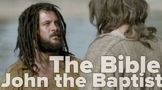 a man with dreadlocks standing next to another man in the water and text that reads, the bible john the baptist