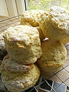 a pile of biscuits sitting on top of a cooling rack