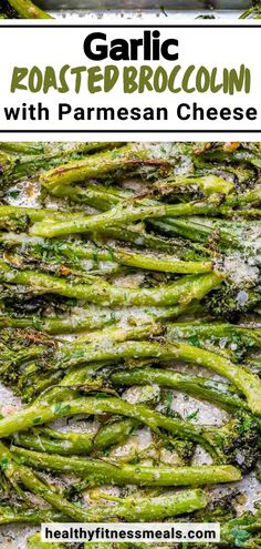 roasted garlic parmesan broccoli in a pan with lemon wedges on the side