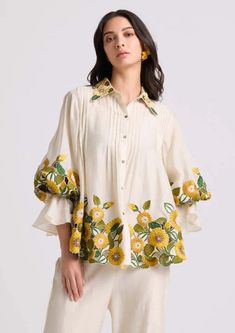 Chandrima | Ivory Sunflower Shirt | INDIASPOPUP.COM Trendy Printed Blouse, Blouses For Women Trendy, Trendy Tops For Women Blouses, Pleated Top Design, Tops And Tunics For Women, Shirt Style Kurti Designs, Elegant Embroidered Yellow Top, Elegant Yellow Embroidered Top, Tunics For Women Classy Casual