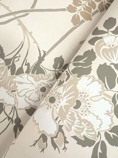 an image of a flowered wallpaper with grey and white flowers on the background