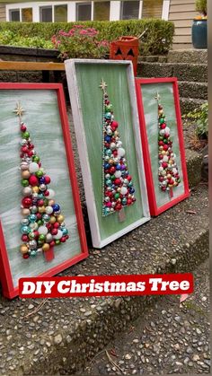 three framed christmas tree ornaments are on display in front of a house with the words diy christmas tree