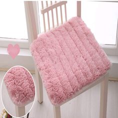 a chair with a pink blanket on top of it next to a heart shaped window sill