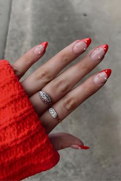 35 Iconic Almond Christmas Nails to Slay the Season Red French And Pearls, Red Christmas Nails With Pearls, Red French Tip Nails Almond With Pearls, Summer Red French Nails, Red French With Diamonds, Red Nails With Pearls On Them, Red Tip Nails With Pearls, Red French Pearl Nails, Red Tips Christmas Nails