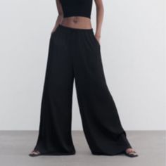 Palazzo- Wide Leg Black Pants With Pull String Elastic Waist. Size Small Black Trousers For Spring, Chic Wide Leg Pants With Loosely Fitted Hips, Black Dress Pants With Loosely Fitted Hips For Spring, Black Dress Pants Loosely Fitted For Spring, Black Wide Leg Pants With Elastic Waistband For Loungewear, Casual Black Wide Leg Dress Pants, Black Wide-leg Spring Pants, Black Wide-leg Pants For Spring, Casual Solid Pants For Going Out