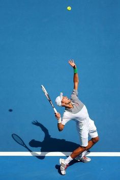 a male tennis player in action on the court