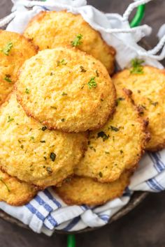 some fried food is in a bowl on a table with a blue and white towel