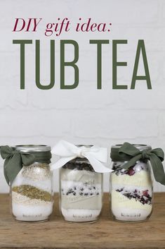 three jars filled with different types of tea sitting on top of a wooden table next to a sign that says diy gift idea tub tea