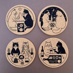 four coasters with cats sitting at a table