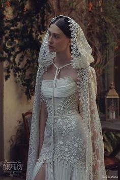 a woman wearing a wedding dress and veil