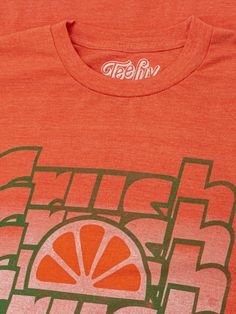 an orange t - shirt with the words high five in green and red on it