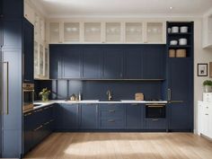 a kitchen with blue cabinets and wooden floors