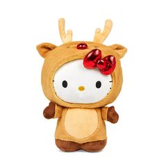 a hello kitty stuffed animal with red bows on it's head and ears, standing upright