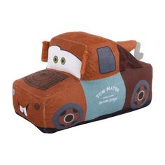 a brown and blue toy truck sitting on top of a white floor