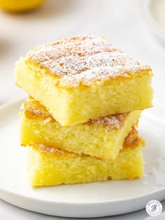 three pieces of lemon cake stacked on top of each other