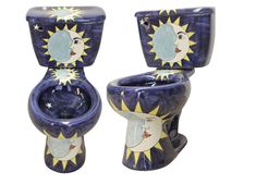 two toilets with sun and moon designs on them