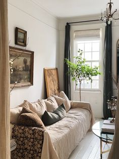 a living room filled with furniture and a window