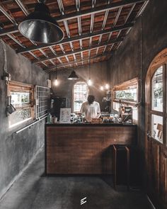 a person sitting at a counter in a building