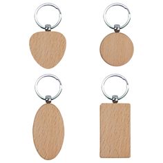 three wooden keychains with metal rings on each one and an oval tag attached to the