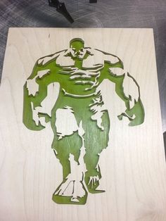 a wooden cutout of a green man