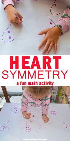 two children playing with paper and scissors on the floor in front of a poster that says heart symmetry