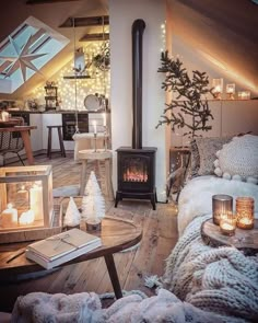 a living room filled with furniture and a fire place next to a table covered in candles