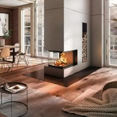 a living room filled with furniture and a fire place in the middle of it's fireplace