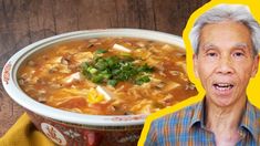 an old man with gray hair is in front of a bowl of soup