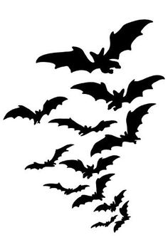 a flock of bats flying through the air