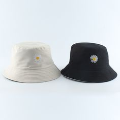 Ladies Bucket Hat With Daisy EmbroideryThis ladies&apos; bucket hat features an embroidered daisy on the front. The hat is crafted from cotton, making it suitable for wear on sunny days, protecting your face from harsh sun rays. Its casual style lends versatility to your everyday attire and its cute daisy design makes it a great accessory to wear when out hiking, traveling, or fishing. Utilizing such a hat could help prevent skin aging by reducing exposure to direct sunlight, providing protection for your head and facial skin.The Benefits Of Wearing A HatThis hat offers multiple benefits, besides its prime function of protection against the sun. The breathable cotton fabric allows for air circulation, keeping your head cool. Its wide brim not only provides desirable sun-shade but also shie Cheap Trendy Yellow Bucket Hat, Cute Bucket Hats, Fishing Bucket Hat, Summer Bucket Hat, Daisy Embroidery, Embroidered Bucket Hat, Bucket Hat White, Cap Girl, Bucket Hat Women