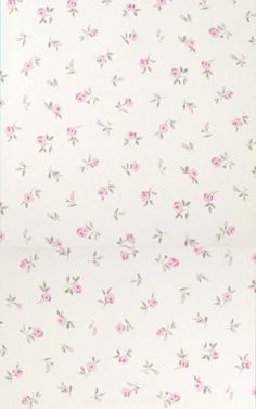 a white wall with pink flowers on it