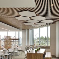 an empty conference room with tables and chairs