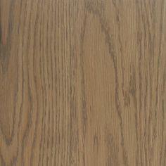 a close up view of the wood grains on an oak flooring paneled in light brown