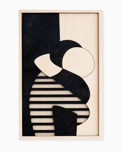 a black and white abstract artwork piece with stripes on the bottom, in a wooden frame